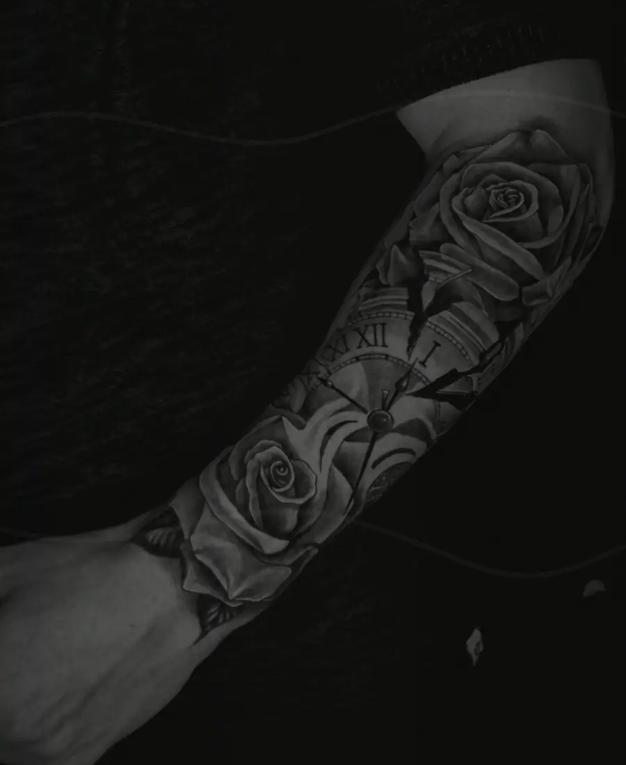 Old sleeve tattoo before a darker cover-up plan.