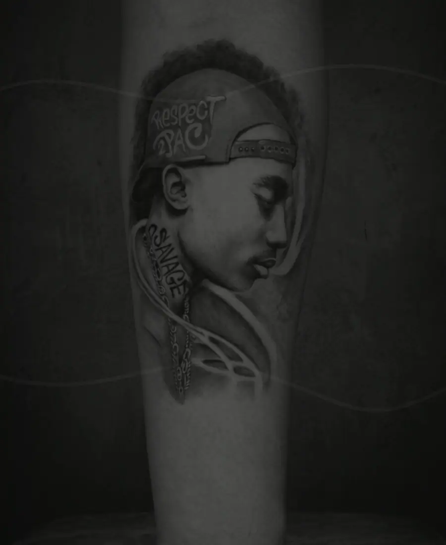 Soft faded portrait tattoo before cover-up work.